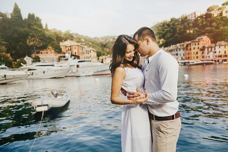Young beautiful couple enjoying ocean view romance. Portofino, Manarola, Cinque Terre, Liguria, Italy.
